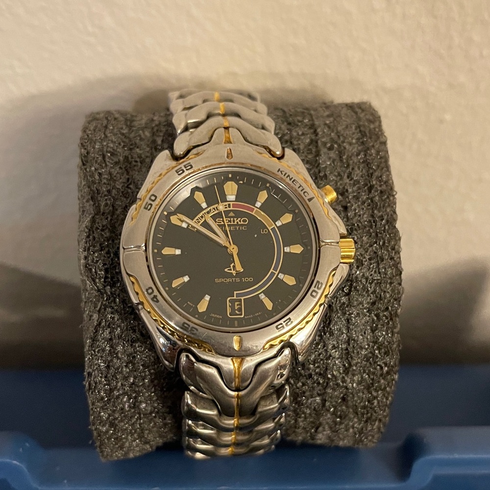 Seiko gold and stainless steel kinetic watch.